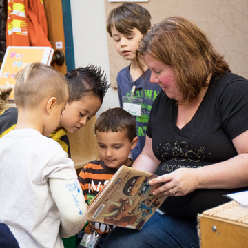 Teacher reading to boys