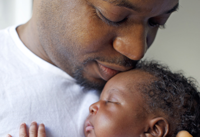 Dad and newborn baby